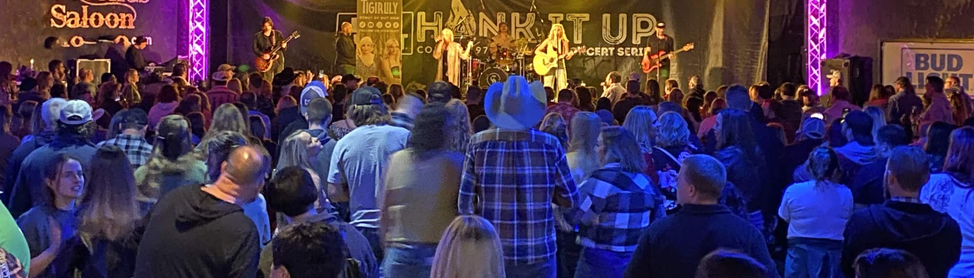 country concert with fans wearing cowboy hats South Bend