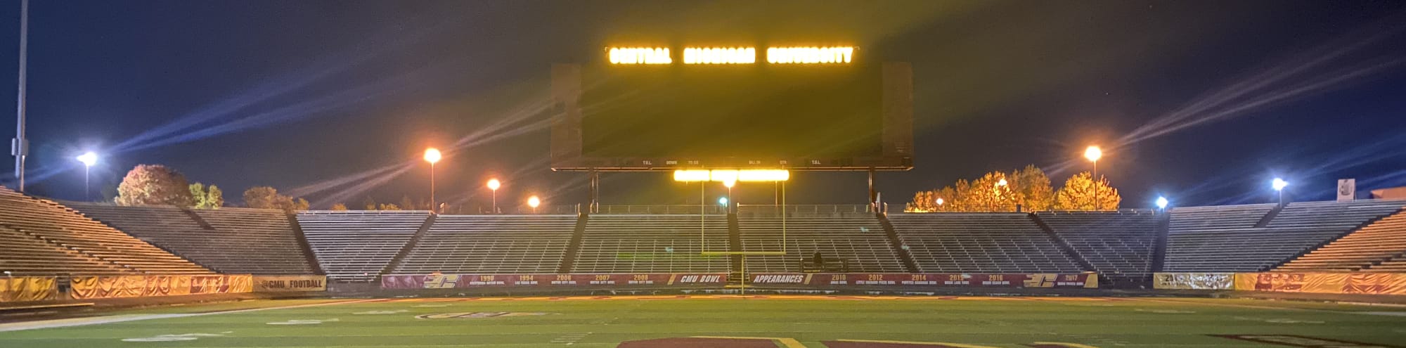 empty football stadium at night under the lights South Bend